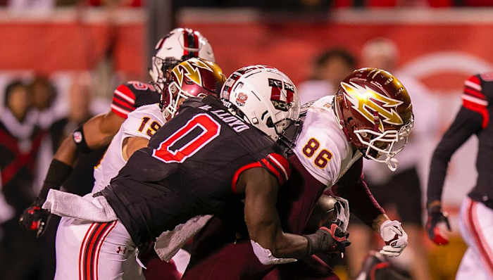 Oct 16, 2021; Salt Lake City, Utah, USA; Utah Utes linebacker Devin Lloyd (0) tackles Arizona State Sun Devils tight end Curtis Hodges (86) during the third quarter at Rice-Eccles Stadium.